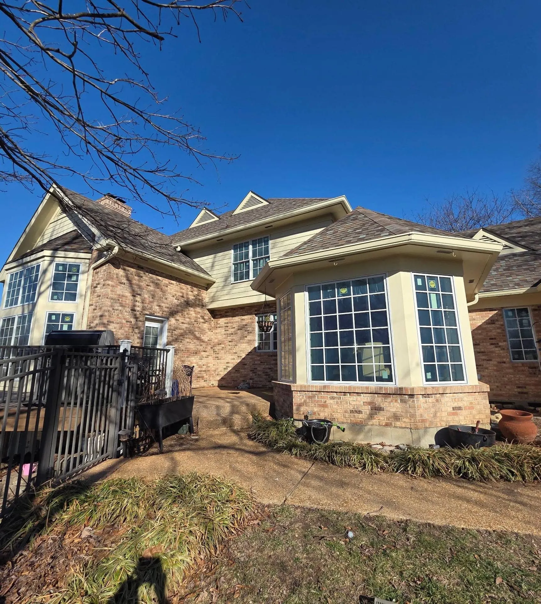 Bay window installed on a two-story brick home.