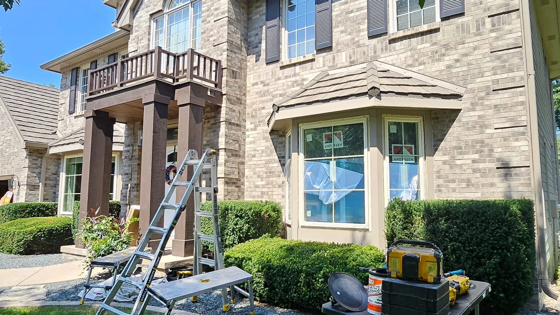 Active window replacement job at a two-story brick home in the Greater Des Moines area.
